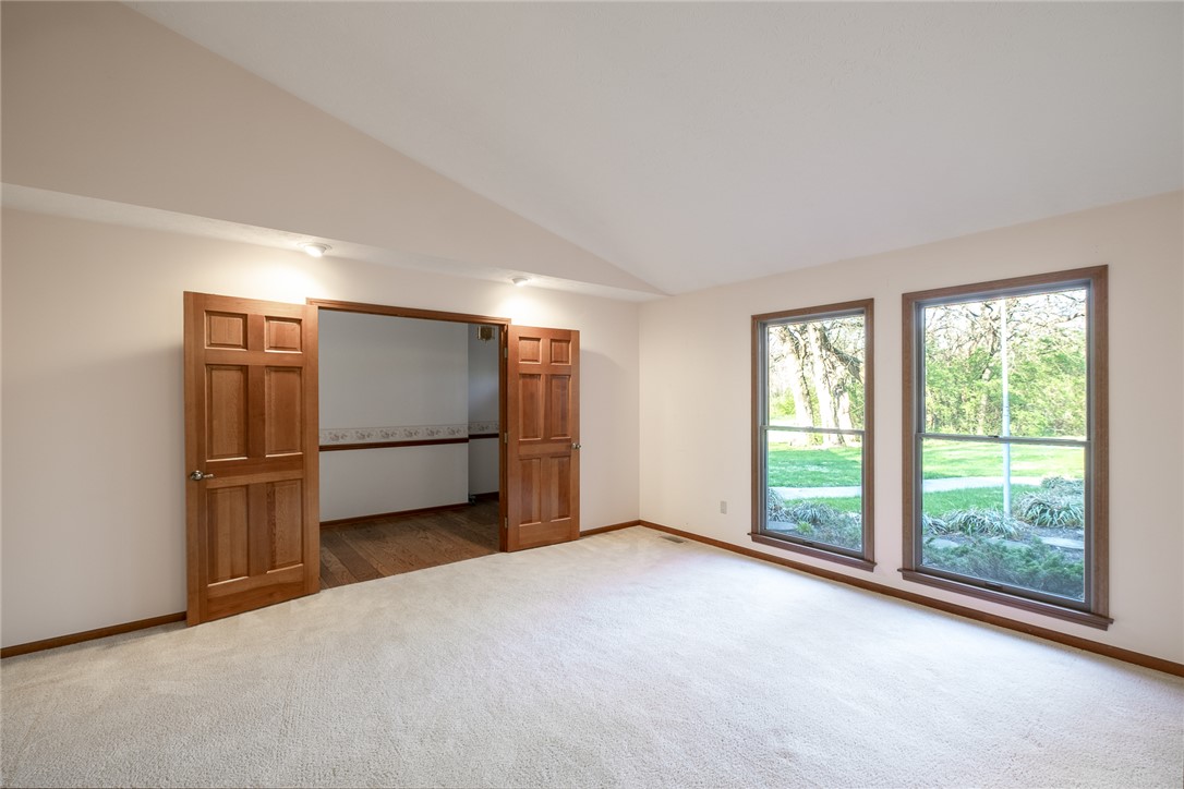 276 South Fairfield Road Bellbrook, OH 45305 - Photo 4 of 38 This bright room features a spacious layout with large windows overlooking a vibrant green landscape.