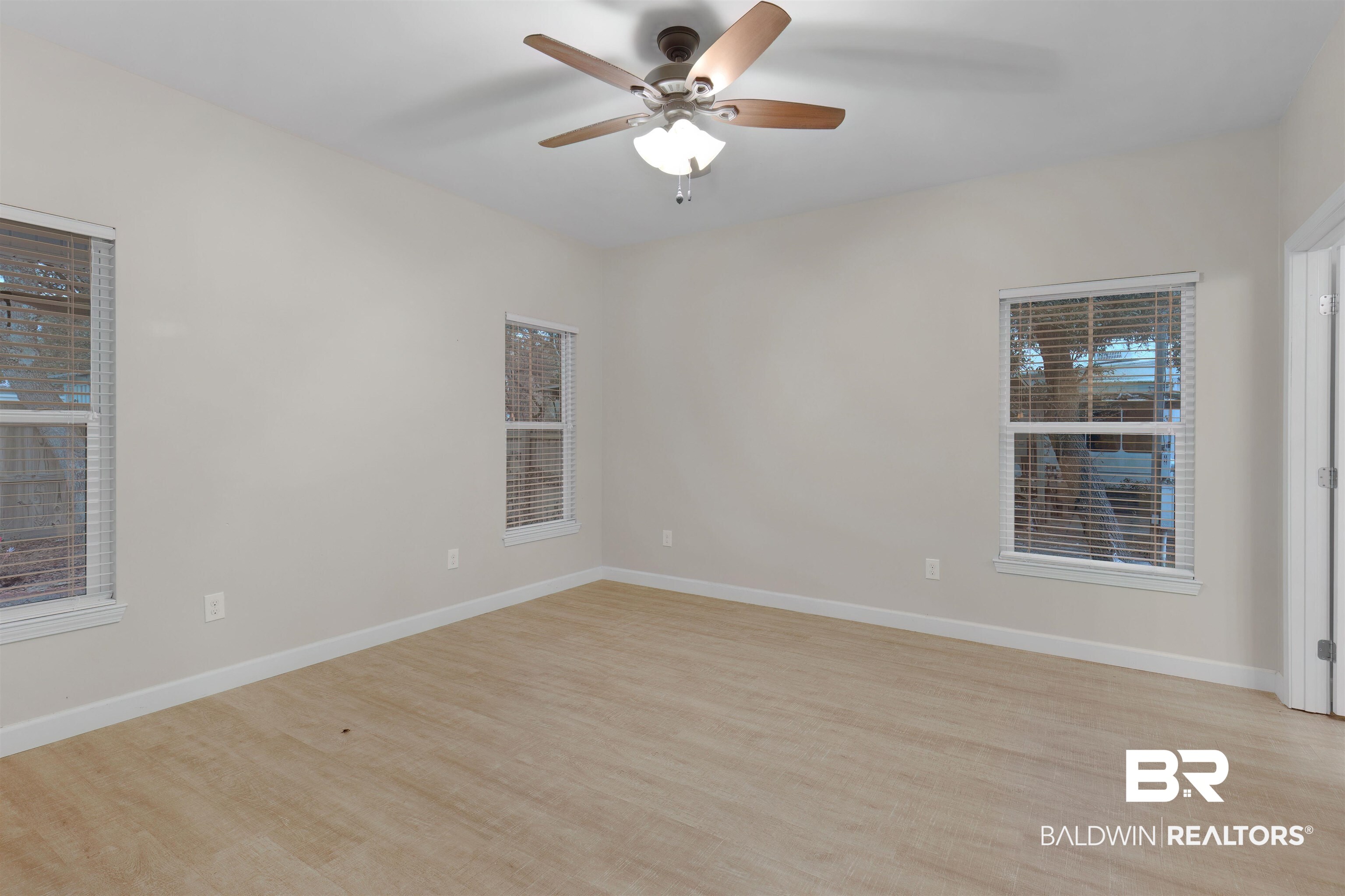 5625 Georgia Street Orange Beach, AL 36561 - Photo 14 of 30 Unfurnished room with ceiling fan and light hardwood / wood-style flooring