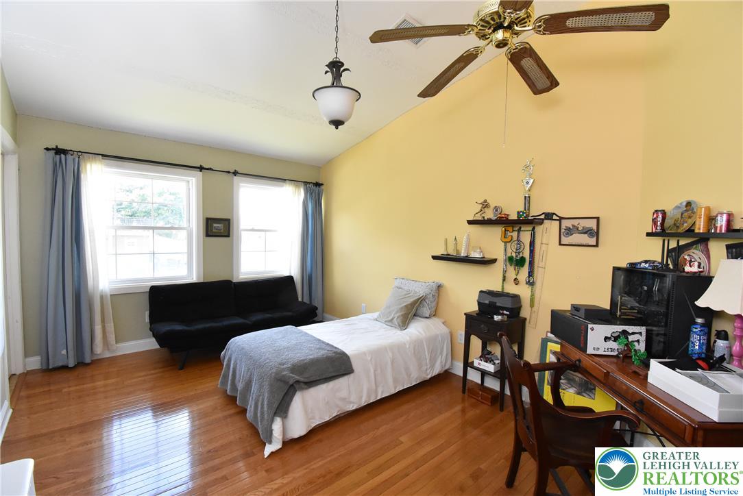 424 Grape Street Whitehall, PA 18052 - Photo 46 of 56 This spacious bedroom offers gleaming hardwood floors and ample natural light through its large windows.