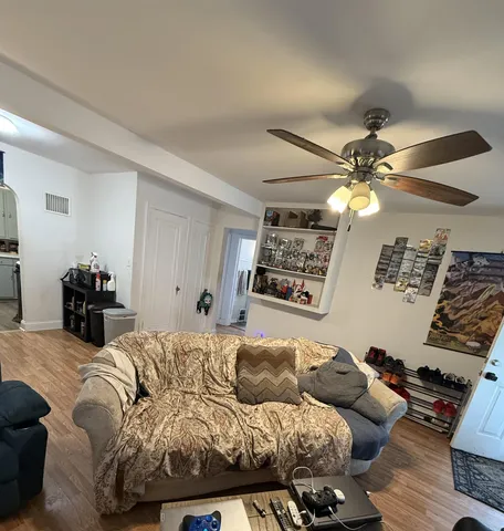 a bedroom with furniture and a chandelier