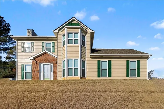front view of a house with a yard