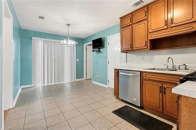 a kitchen with stainless steel appliances granite countertop a refrigerator sink and cabinets