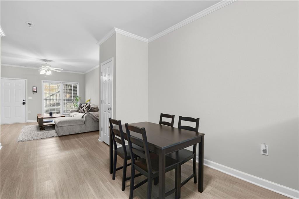 3675 Peachtree Road Northeast, Unit 45 Atlanta, GA 30319 - Photo 26 of 42 a living room with furniture and a wooden floor