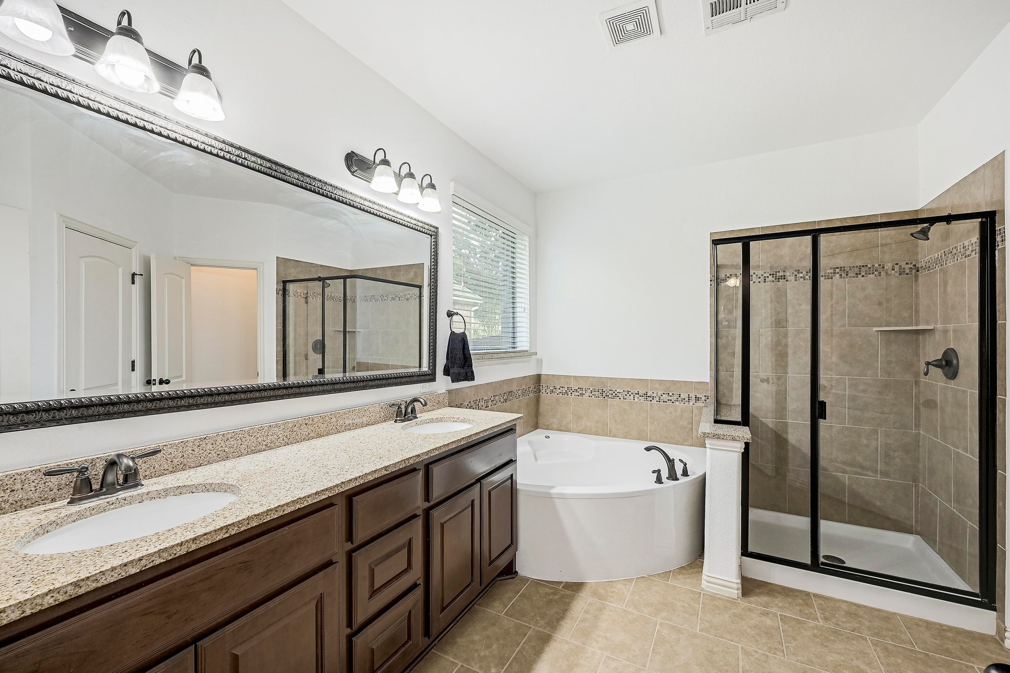 2229 Turtle Mountain Bend Austin, TX 78748 - Photo 17 of 38 a bathroom with a granite countertop bathtub sink double and mirror