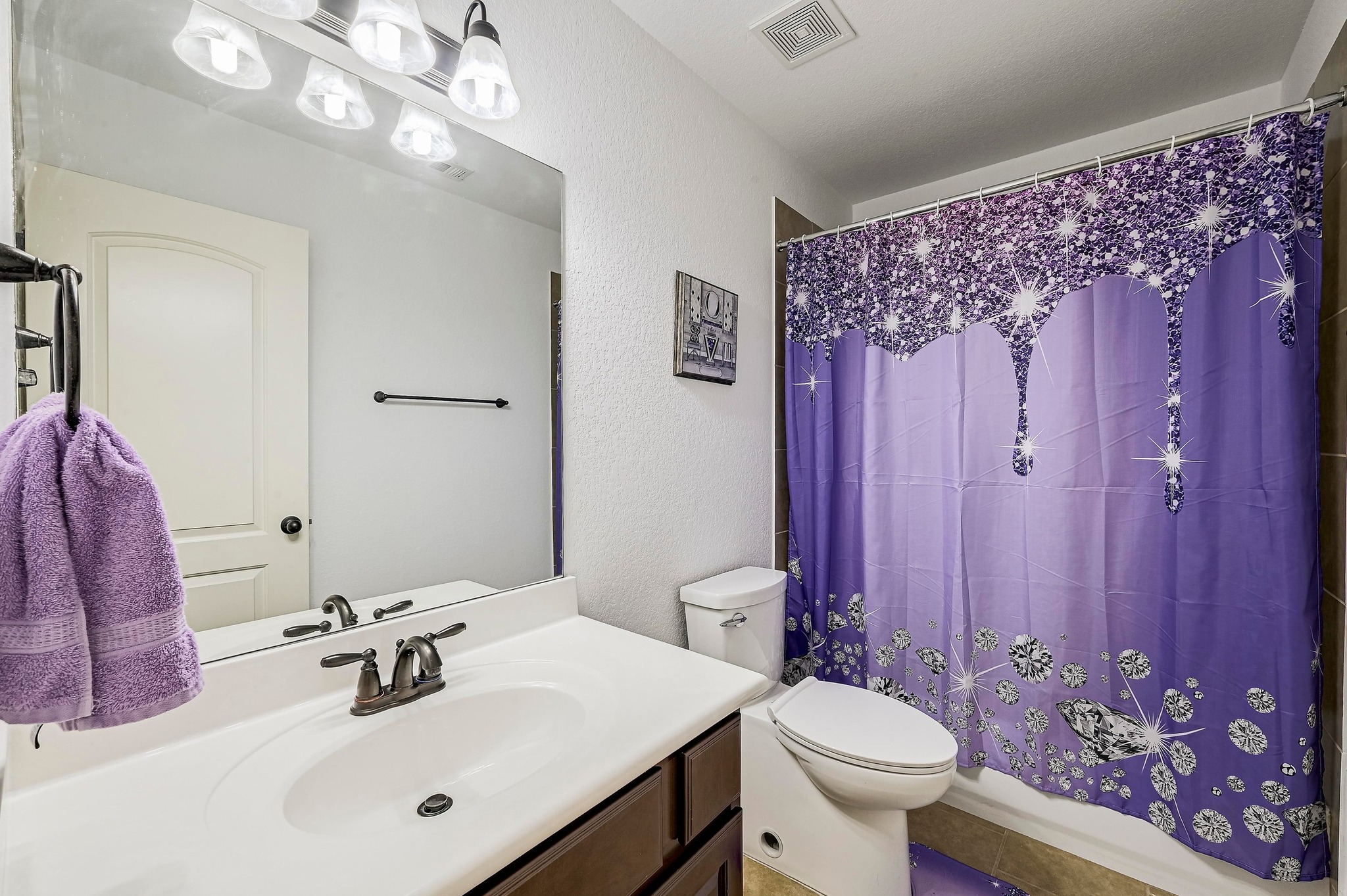 2229 Turtle Mountain Bend Austin, TX 78748 - Photo 29 of 38 a bathroom with a sink a toilet and shower curtain
