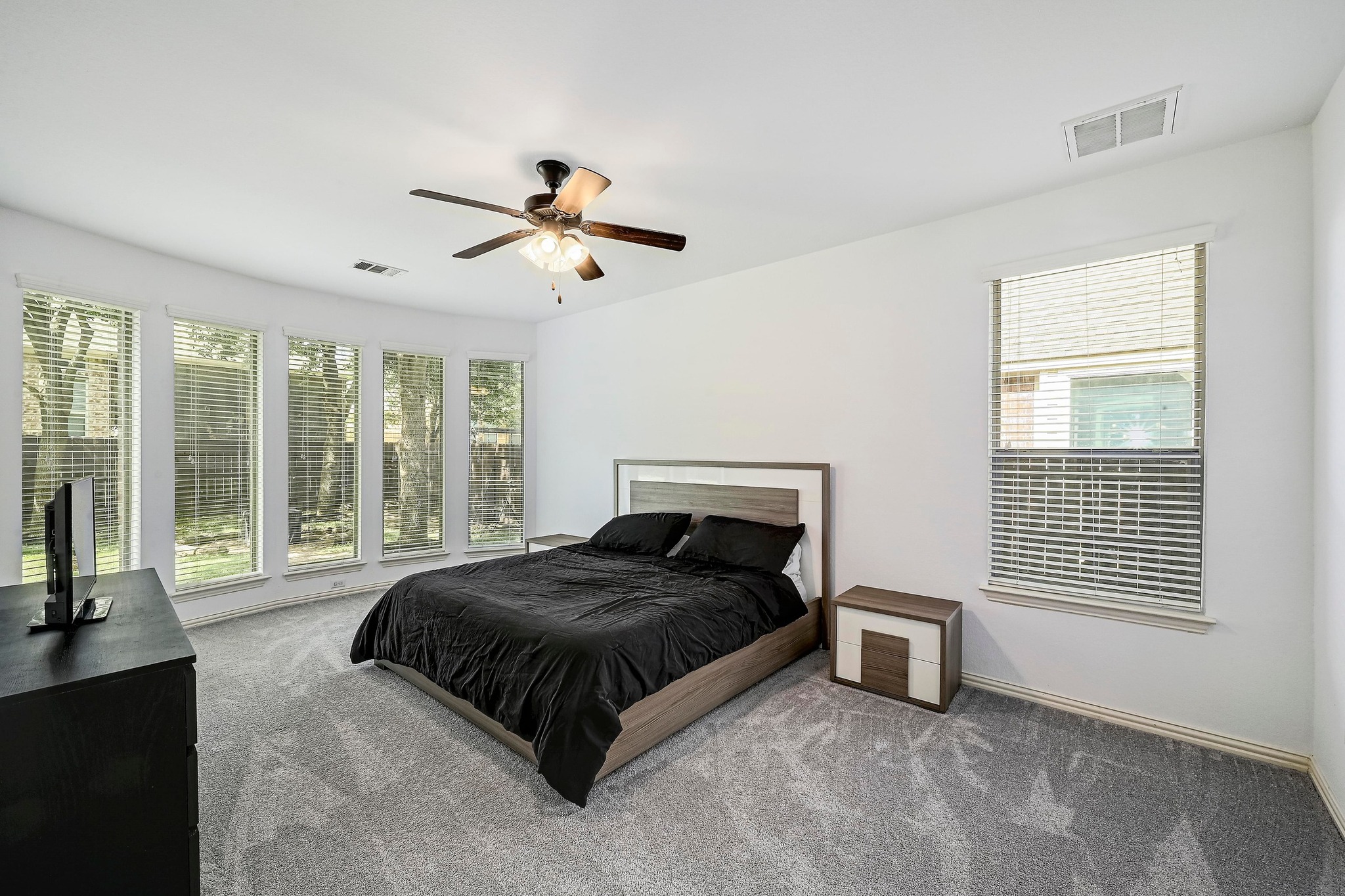 2229 Turtle Mountain Bend Austin, TX 78748 - Photo 3 of 38 a spacious bedroom with a bed and glass door