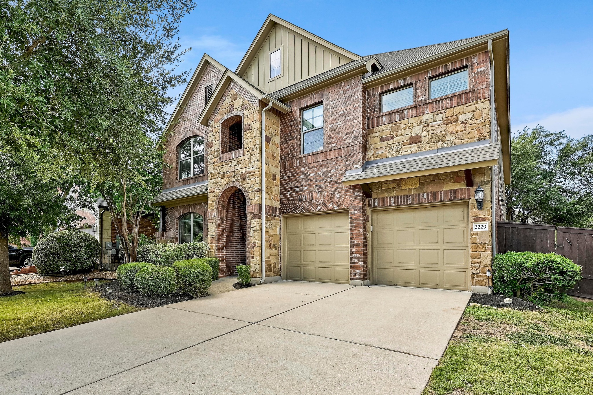 2229 Turtle Mountain Bend Austin, TX 78748 - Photo 5 of 38 a front view of a house with a garden and plants