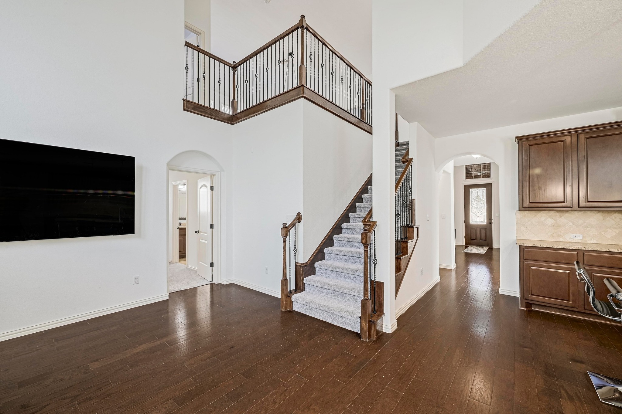 2229 Turtle Mountain Bend Austin, TX 78748 - Photo 8 of 38 a view of a livingroom with wooden floor and a fireplace