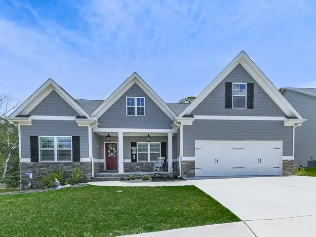 front view of a house with a yard