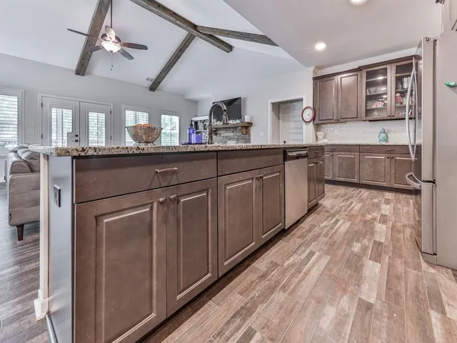 a kitchen with a sink cabinets and window
