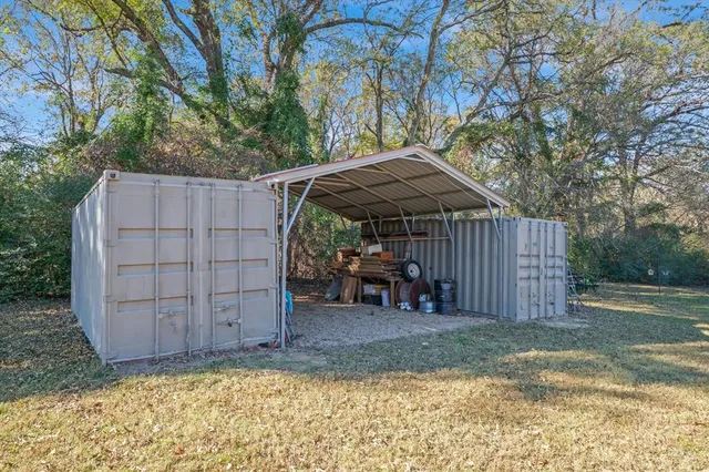 a view of a park with iron fence