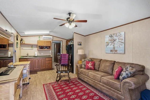 a view of a livingroom with furniture and a flat screen tv