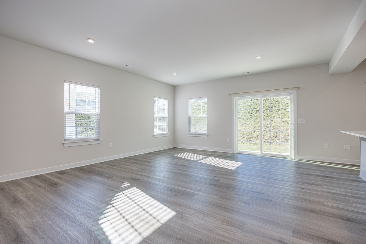 968 Caywood Road Smyrna, TN 37167 - Photo 14 of 54 a view of an empty room with wooden floor and window