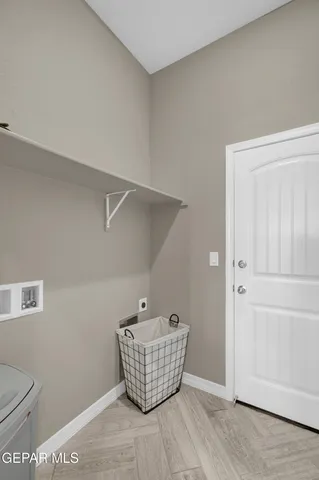 a view of a dining room with furniture wooden floor and a chandelier