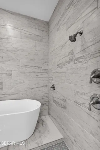 a white bath tub sitting in a bathroom