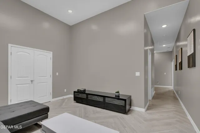 a bathroom with a toilet a sink a mirror and vanity