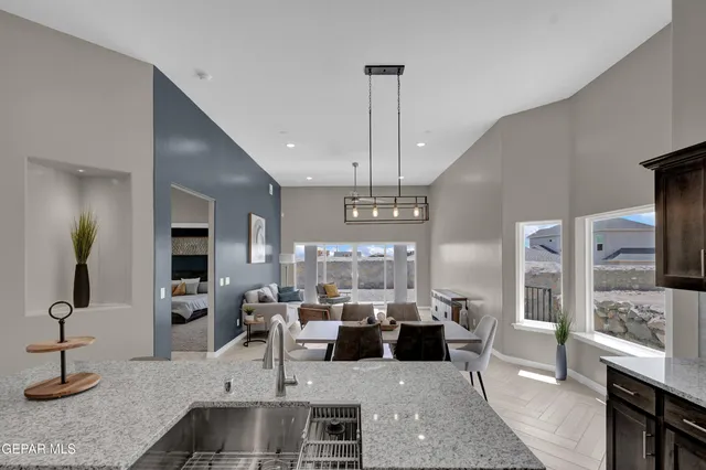 a living room with lots of furniture and a chandelier