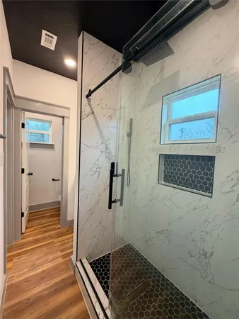 a bathroom with a granite countertop sink mirror and toilet