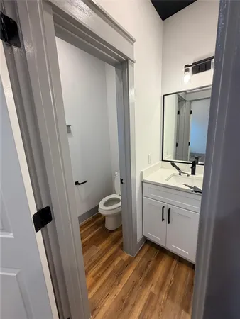 an empty room with fan and windows