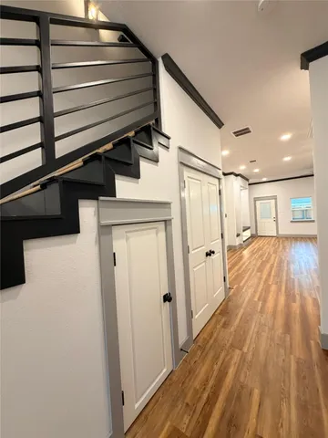 a view of entryway with wooden floor