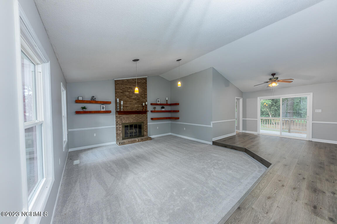219 Manchester Road Havelock, NC 28532 - Photo 2 of 16 Living room with cozy fireplace & dining area