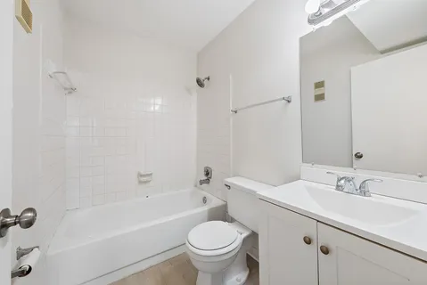 a bathroom with a sink toilet and a bathtub