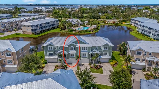 an aerial view of a houses with a swimming pool
