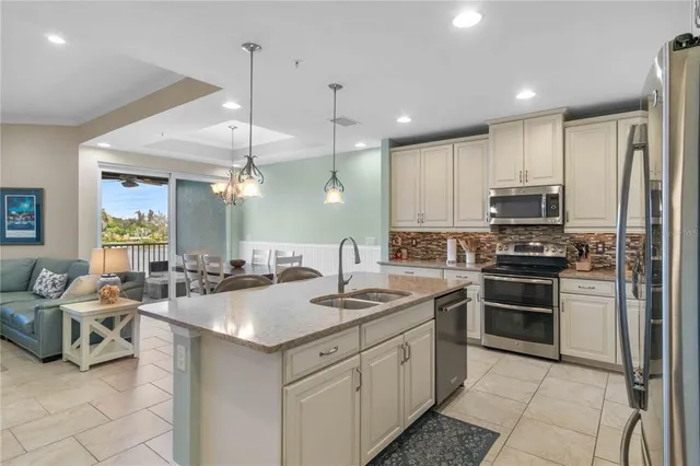 a large kitchen with a large counter top appliances and furniture