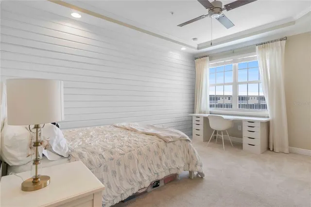 a spacious bathroom with a granite countertop sink a mirror and a shower