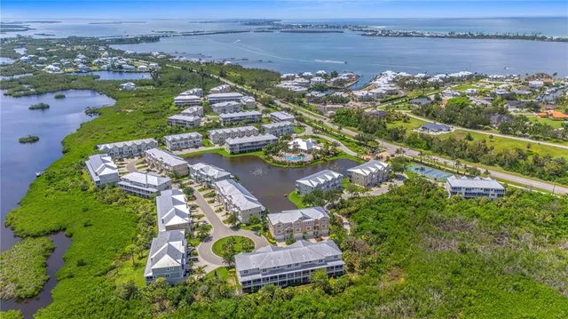 an aerial view of a house with a lake view