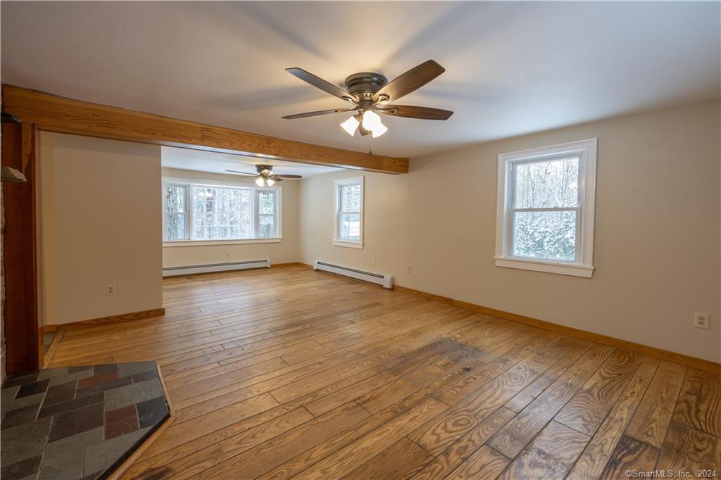 370 Gillette Road New Hartford, CT 06057 - Photo 1 of 1 a view of an empty room with window and wooden floor