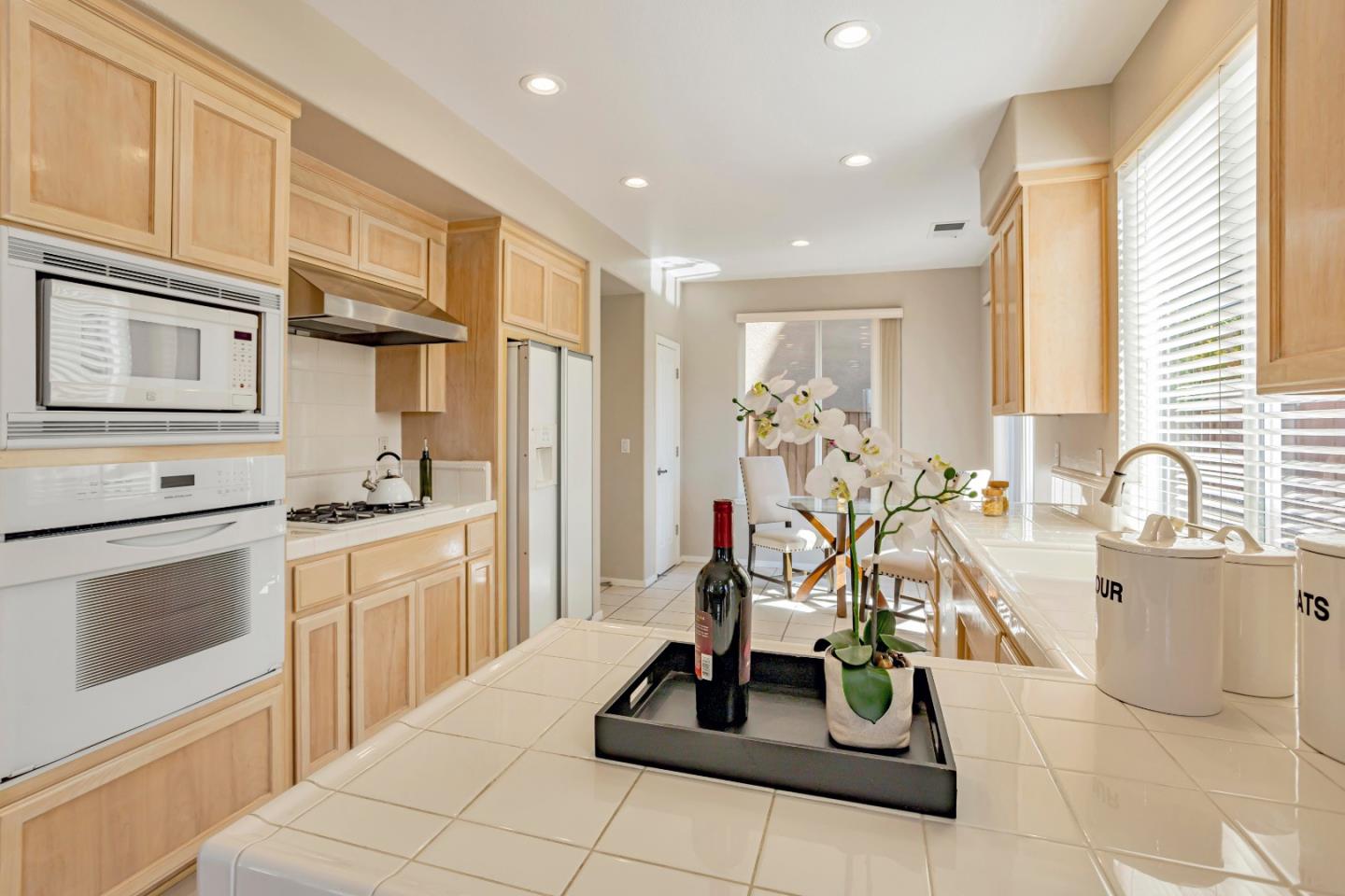964 Cameron Circle Milpitas, CA 95035 - Photo 12 of 48 a view of a kitchen with kitchen island granite countertop appliances and cabinets