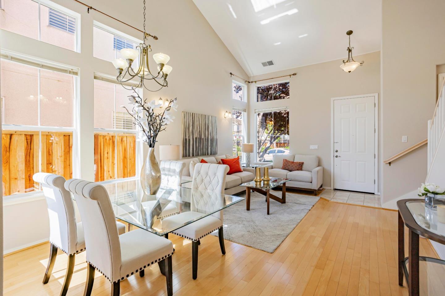 964 Cameron Circle Milpitas, CA 95035 - Photo 17 of 48 a living room with furniture a chandelier and a dining table