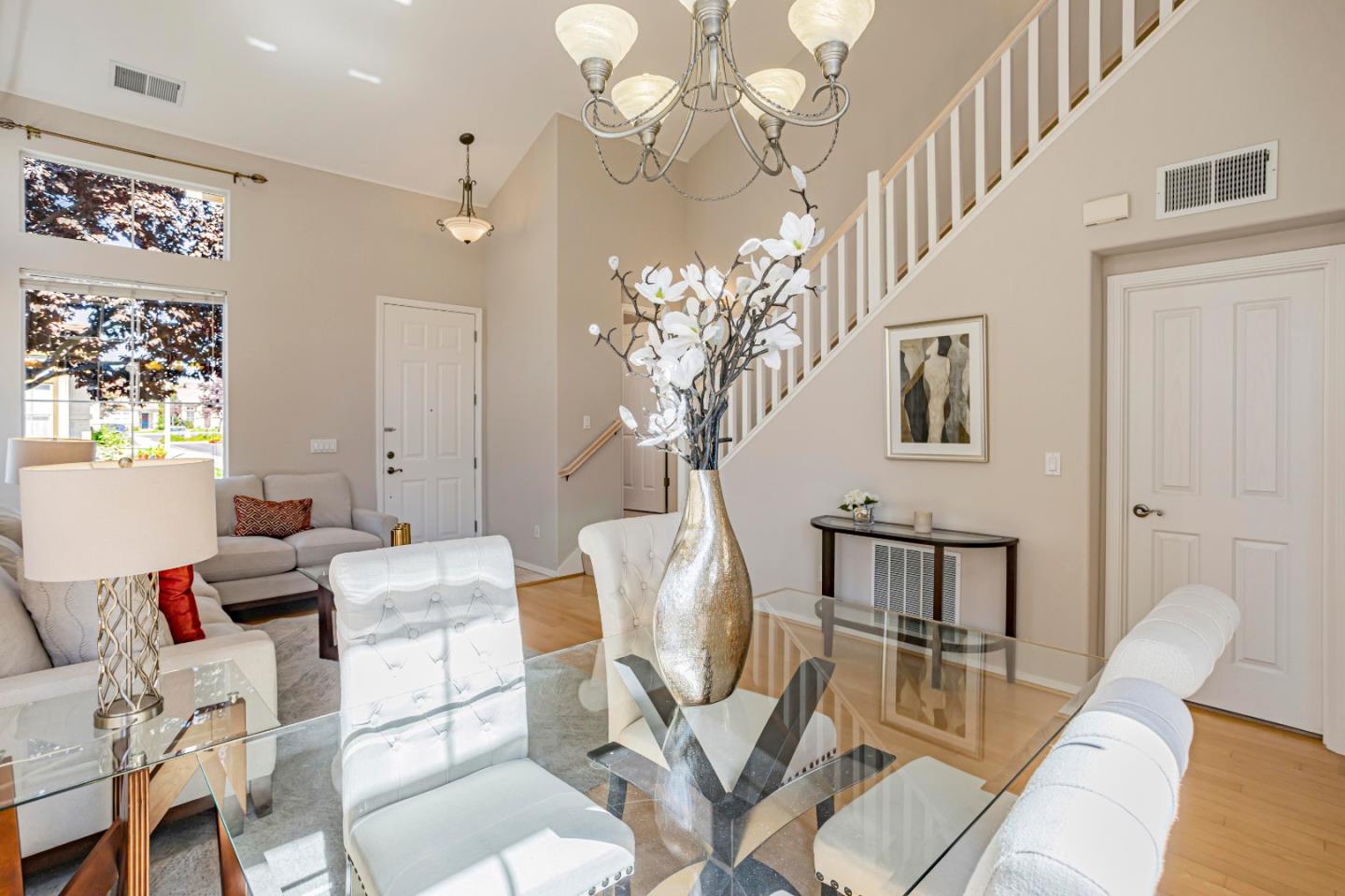 964 Cameron Circle Milpitas, CA 95035 - Photo 19 of 48 a view of a dining room with furniture a chandelier and wooden floor