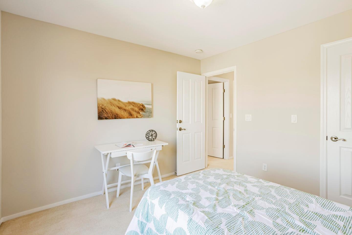 964 Cameron Circle Milpitas, CA 95035 - Photo 23 of 48 a bedroom with a bed and a chair in it