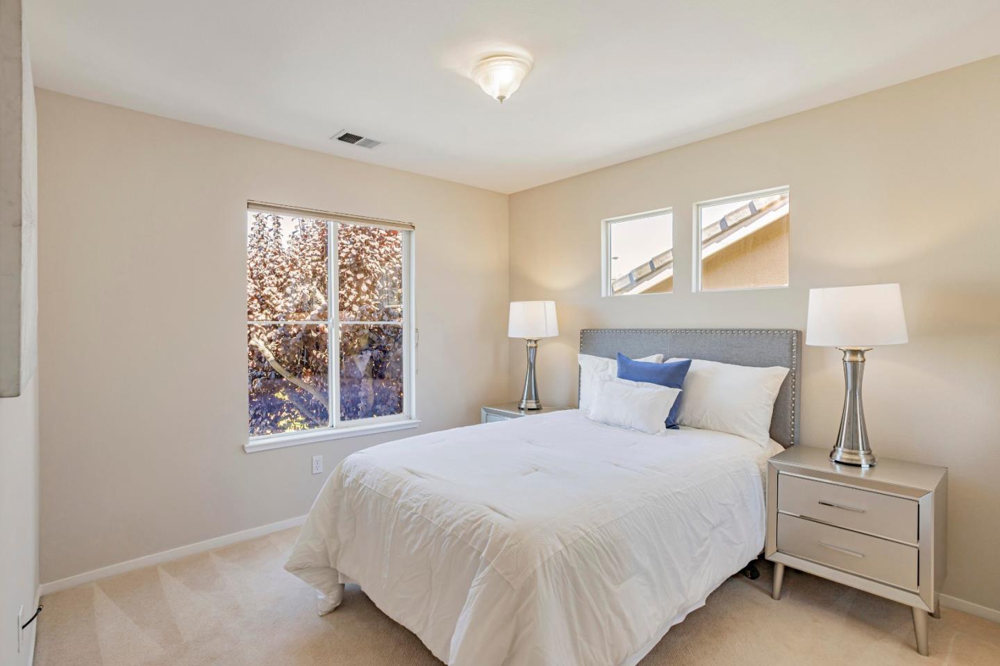 964 Cameron Circle Milpitas, CA 95035 - Photo 24 of 48 a bedroom with a bed and a night stand