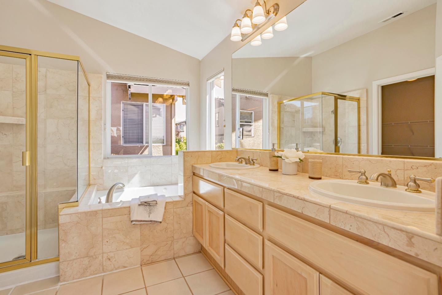 964 Cameron Circle Milpitas, CA 95035 - Photo 29 of 48 a spacious bathroom with a double vanity sink a mirror and a bathtub