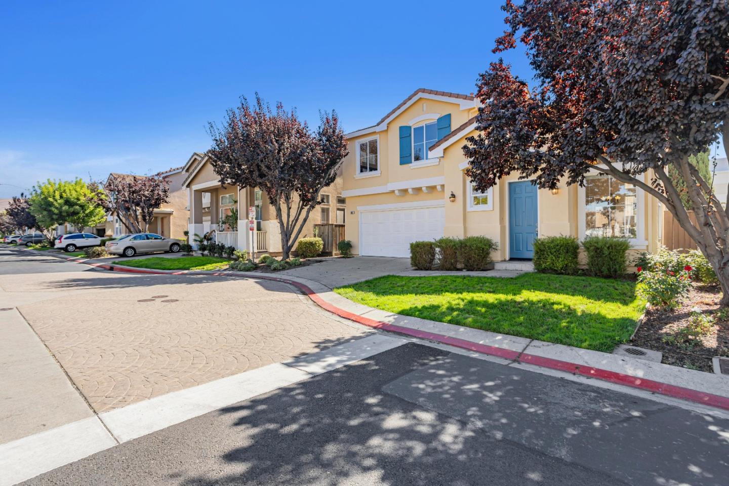 964 Cameron Circle Milpitas, CA 95035 - Photo 3 of 48 a front view of a house with a yard and potted plants