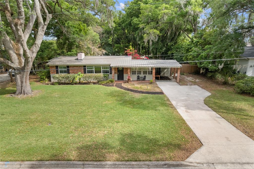 1735 Southeast 5th Street Ocala, FL 34471 - Photo 1 of 1 a view of a house with backyard garden and sitting area