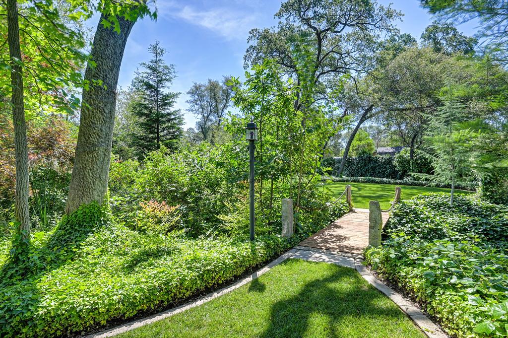 3557 Val Verde Road Loomis, CA 95650 - Photo 59 of 71 a view of a garden with a fountain