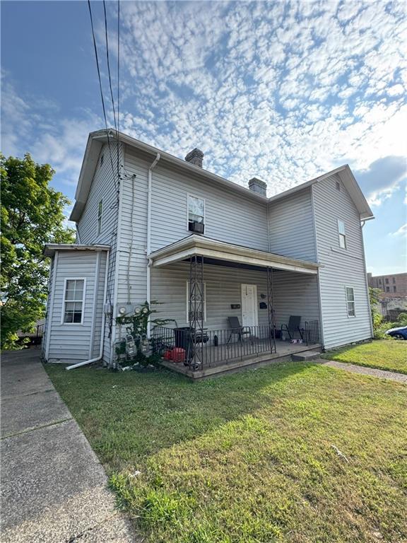 291 Pinney Street Rochester, PA 15074 - Photo 19 of 20 a front view of house with yard and outdoor seating