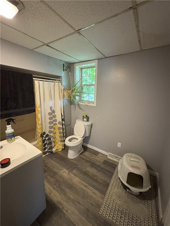 291 Pinney Street Rochester, PA 15074 - Photo 6 of 20 a bathroom with a sink toilet a mirror and window