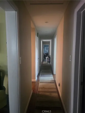 a view of a hallway with a livingroom