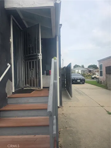 a view of a patio with a table and chairs