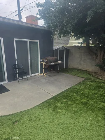 a view of a backyard of the house