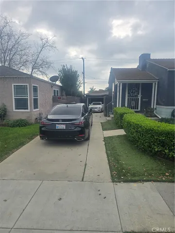 a house view with a backyard space