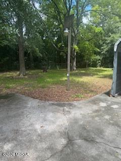 1803 Rocky Creek Road Macon, GA 31206 - Photo 11 of 13 a view of a yard with a tree