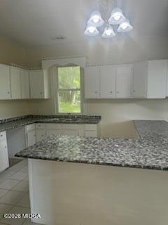1803 Rocky Creek Road Macon, GA 31206 - Photo 8 of 13 a kitchen with a counter top space cabinets and a window