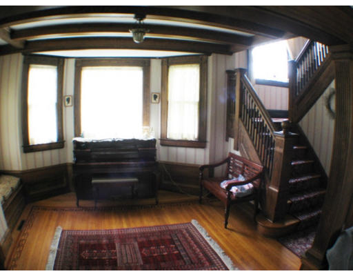 47 Fairfield Street Springfield, MA 01108 - Photo 3 of 5 a living room with a bed and a window