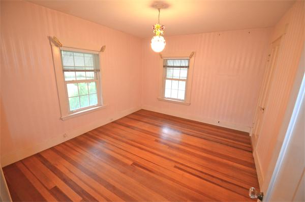 16 Overlook Road Wakefield, MA 01880 - Photo 10 of 22 a view of an empty room with wooden floor and a window